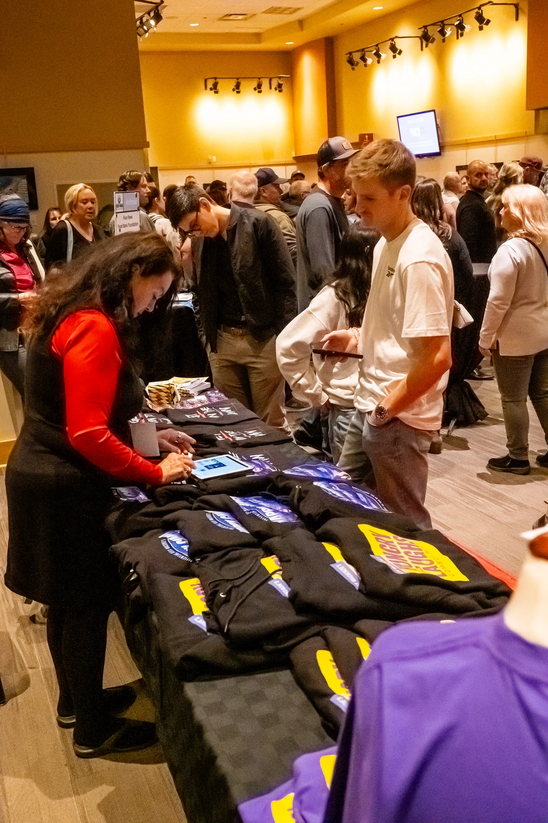 Guests visiting the merchandise table before the show