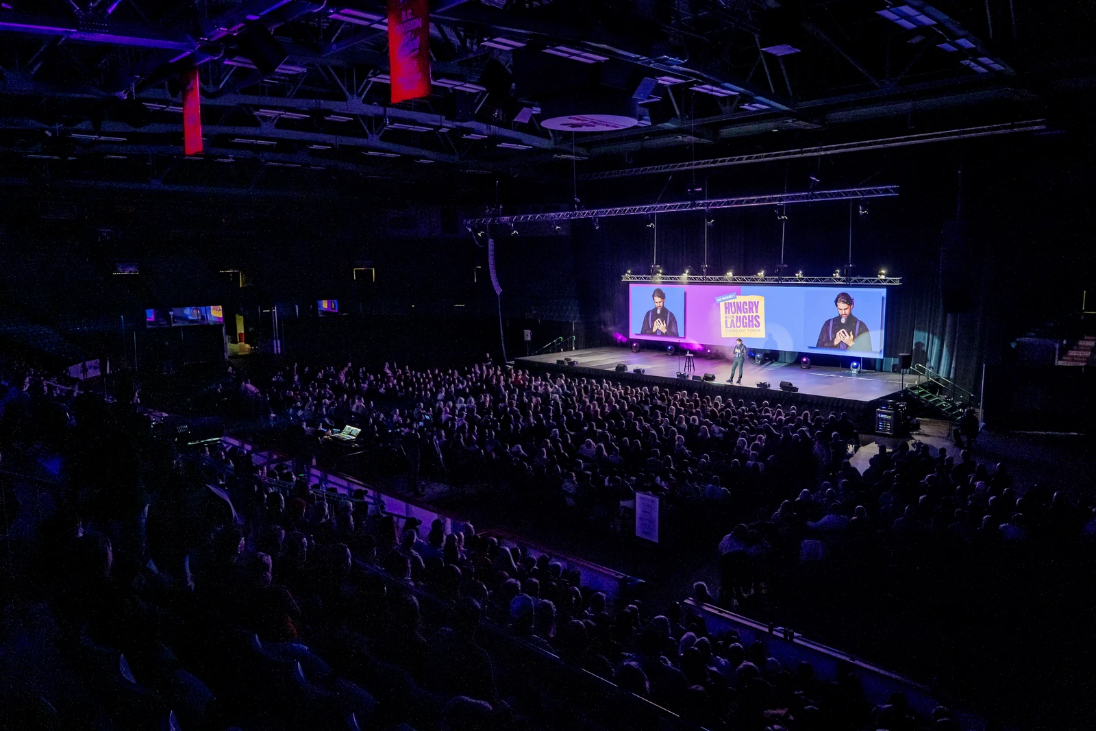 A wide view of the full theatre and Hungry for Laughs stage