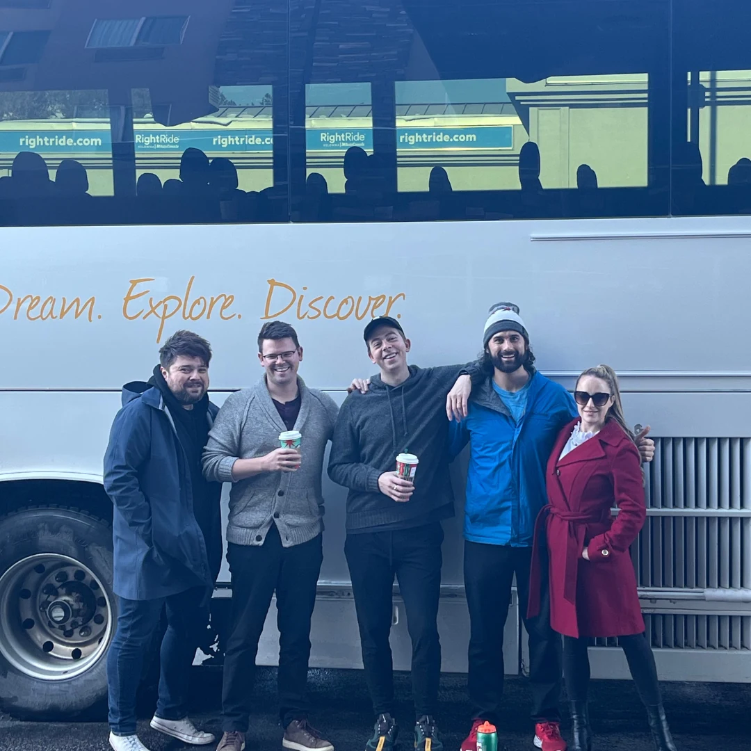 The tour crew beside their bus